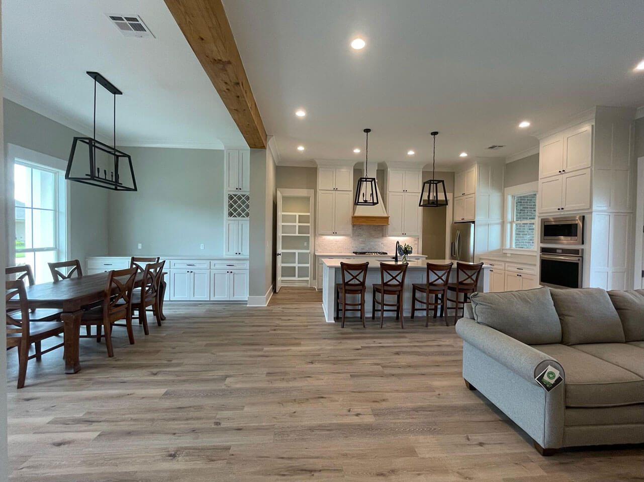 Combination living and dining room by construction companies in Houma LA